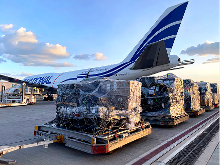 Cargo beside an airplane