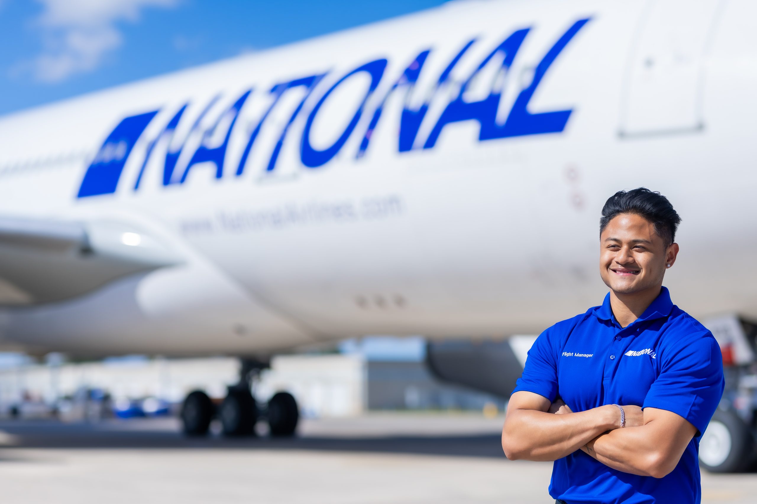 A worker beside an airplane