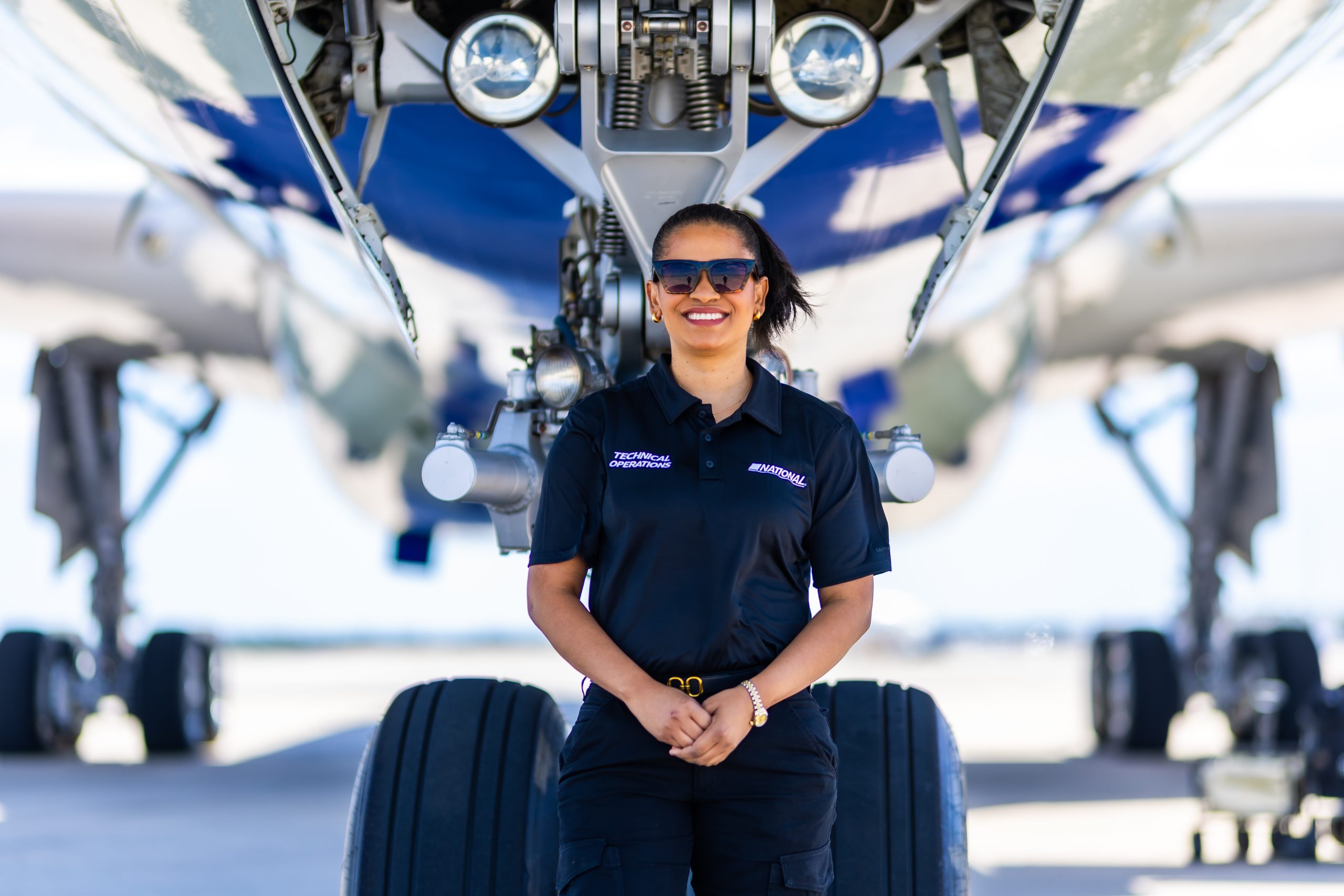 A worker beside an airplane