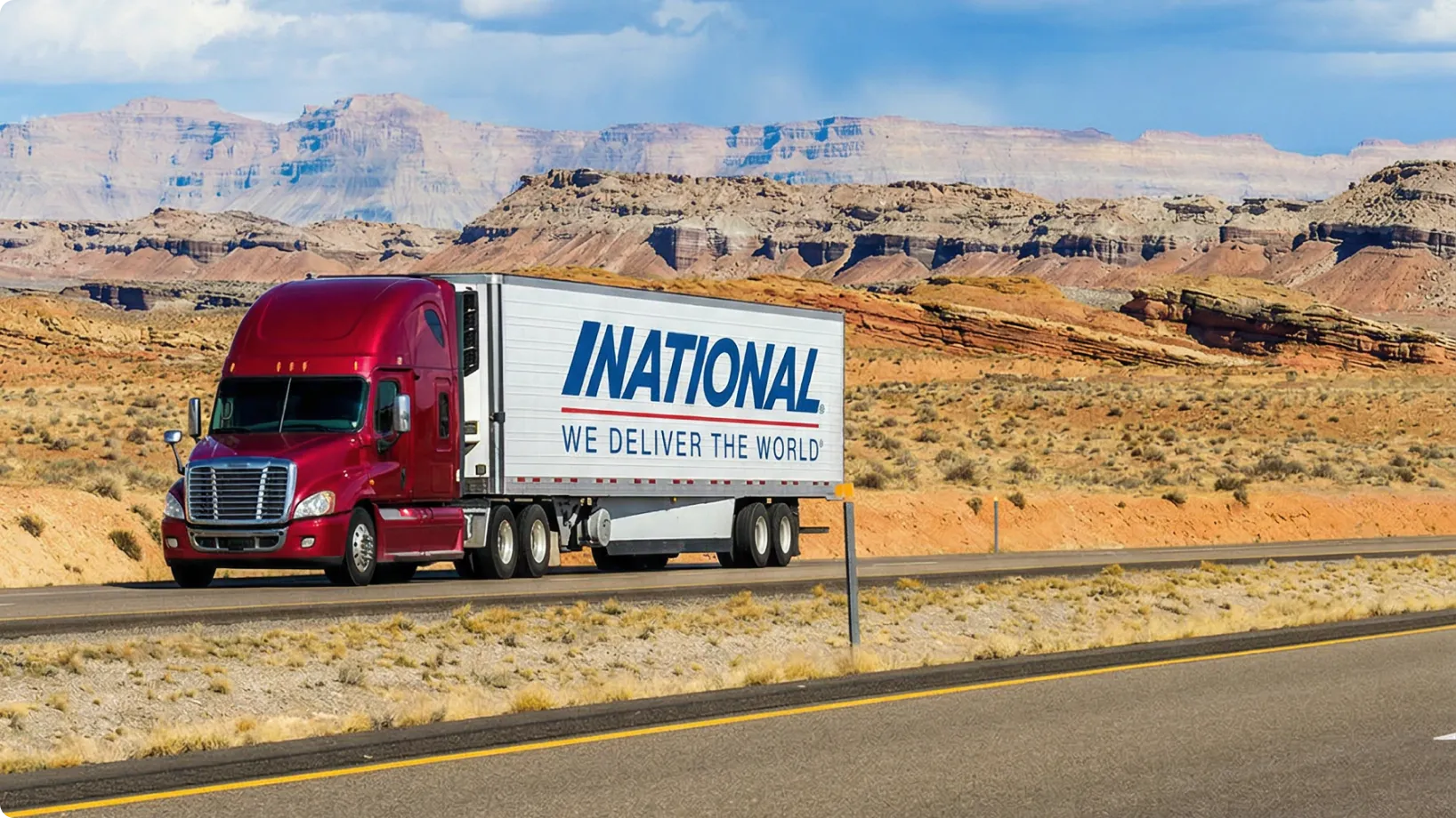 A truck driving during the day