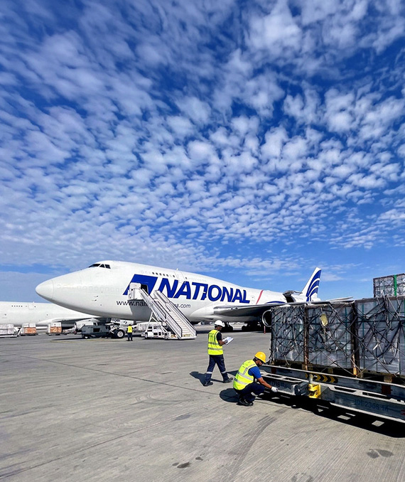 Cargo being prepared by a plane.