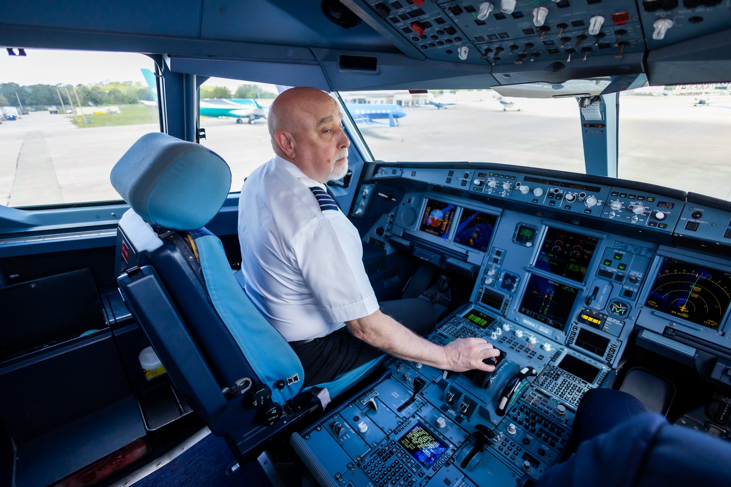 A pilot in the cockpit of an airplane