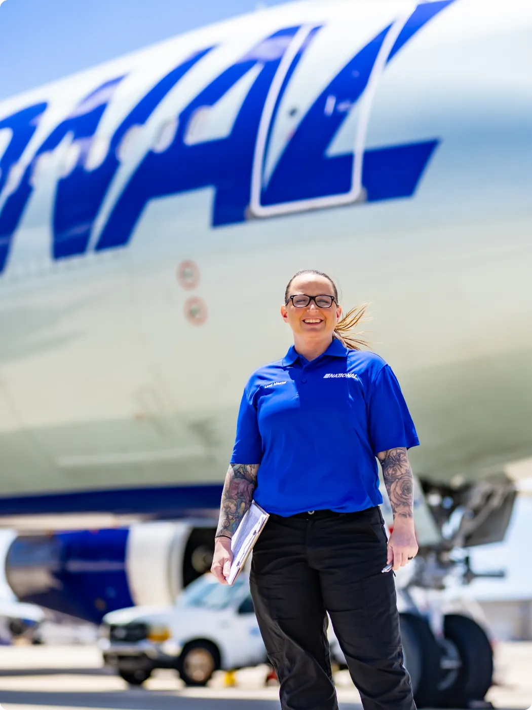 A person standing beside an airplane